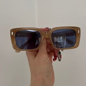 Brown frames blue lense sunglasses